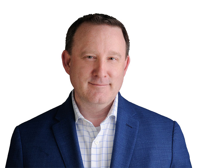 Jason Acker with a blue striped white shirt with a blue blazer