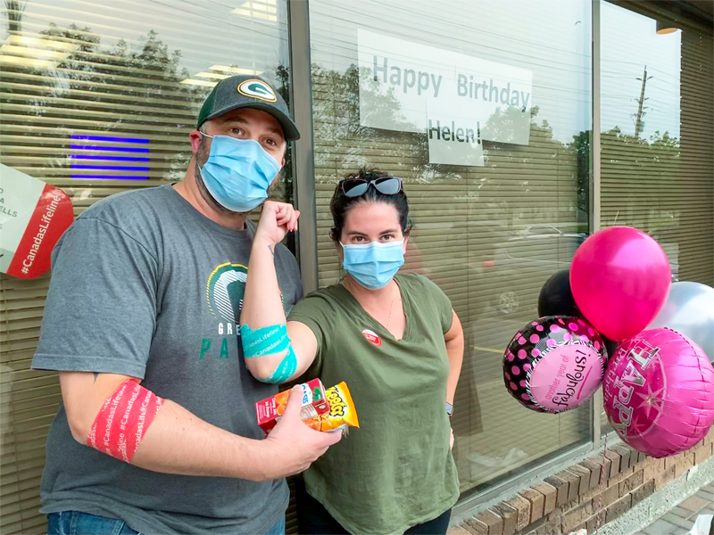 Image of Ashley and Adam Glauser pose after donating blood for the first time