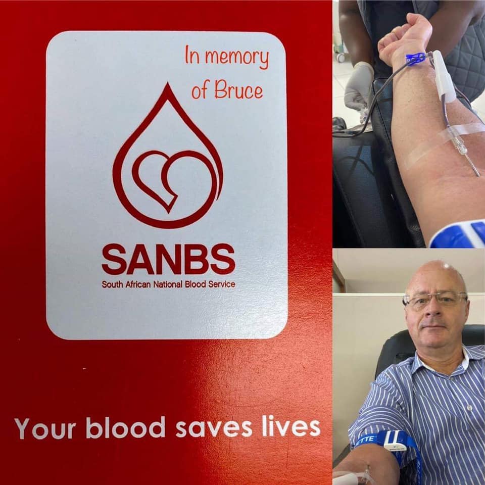 Image of a man donating blood wearing blue striped shirt