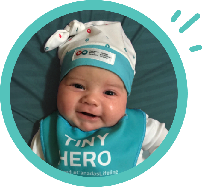 Baby with wearing a Canadian Blood Services toque.