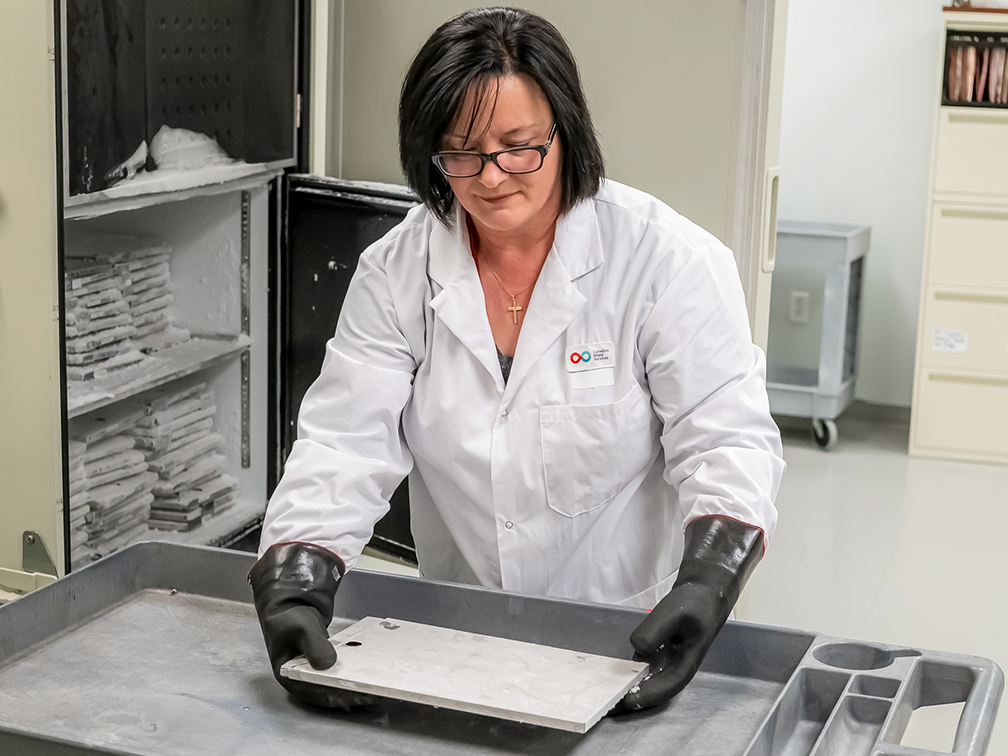woman handling cryopreservation tool