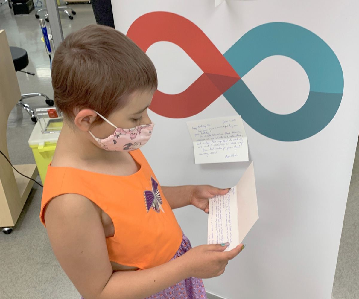 Abigale Latoszek reading a birthday card