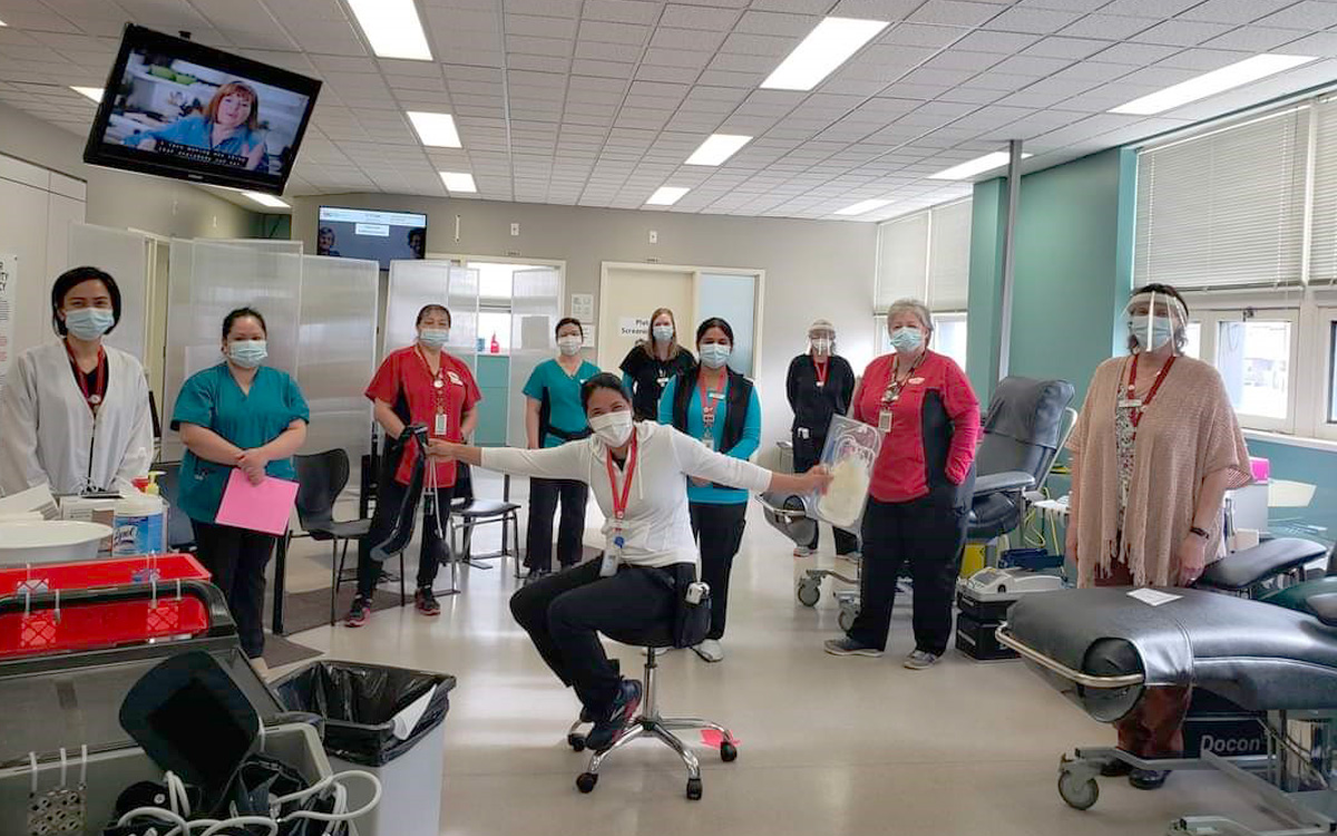 Annette Regalado and her colleagues in their scrubs at Canadian Blood Services’ donor centre in Regina, Sask.