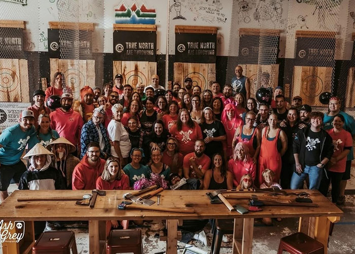 Group photo of participants at the 2024 Burn Battle Blood Bath charity axe throwing competition.