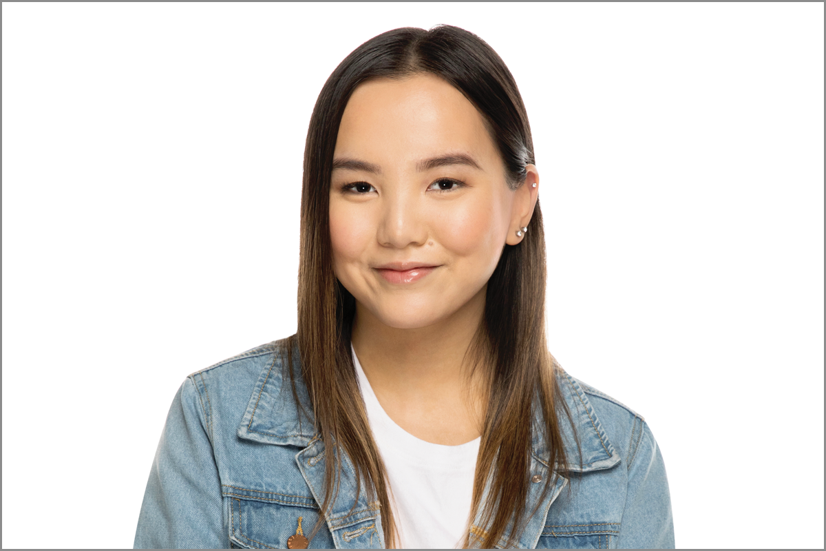 Cord blood recipient, Crystal Nguyen pose in front of a white background.