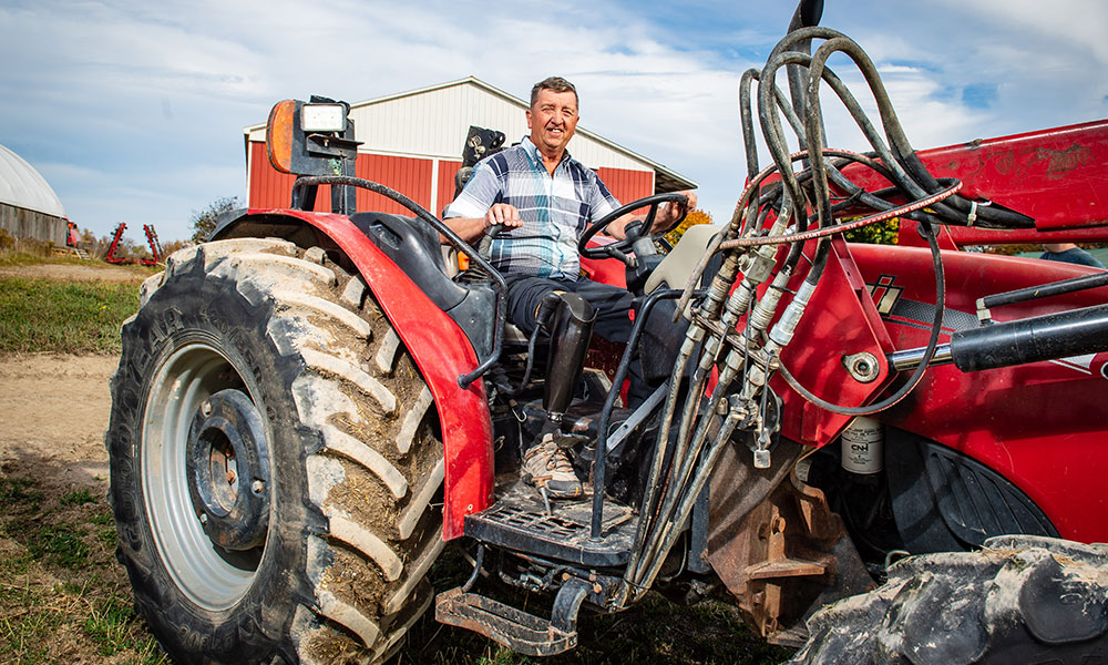 Blood recipient driving a red tractor