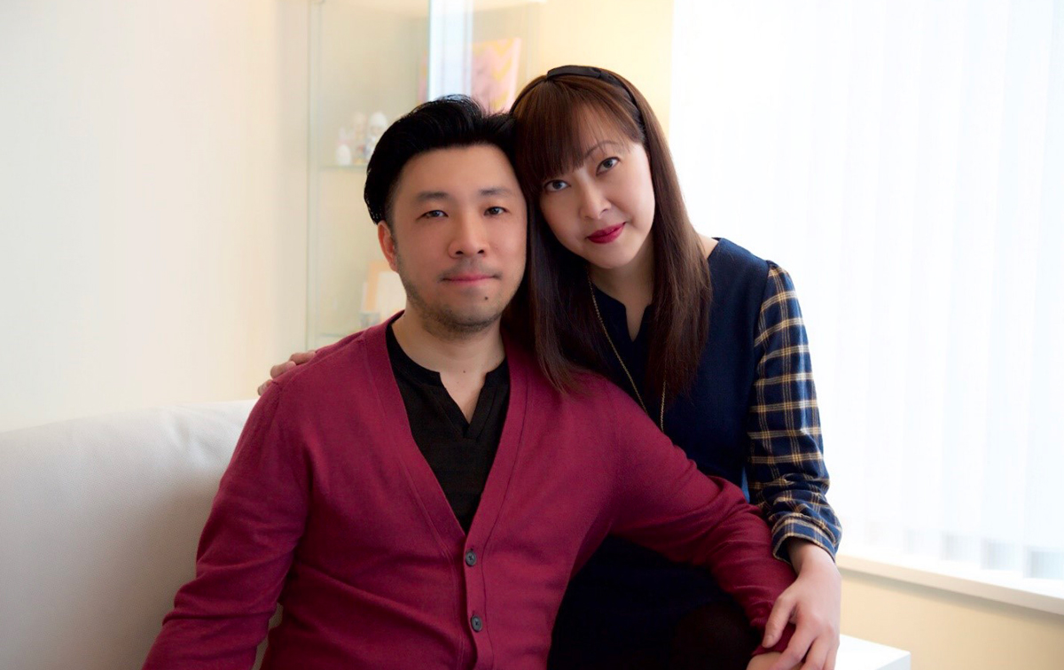 Edmond Chan in a red cardigan and his late wife, Christina in a black sweater