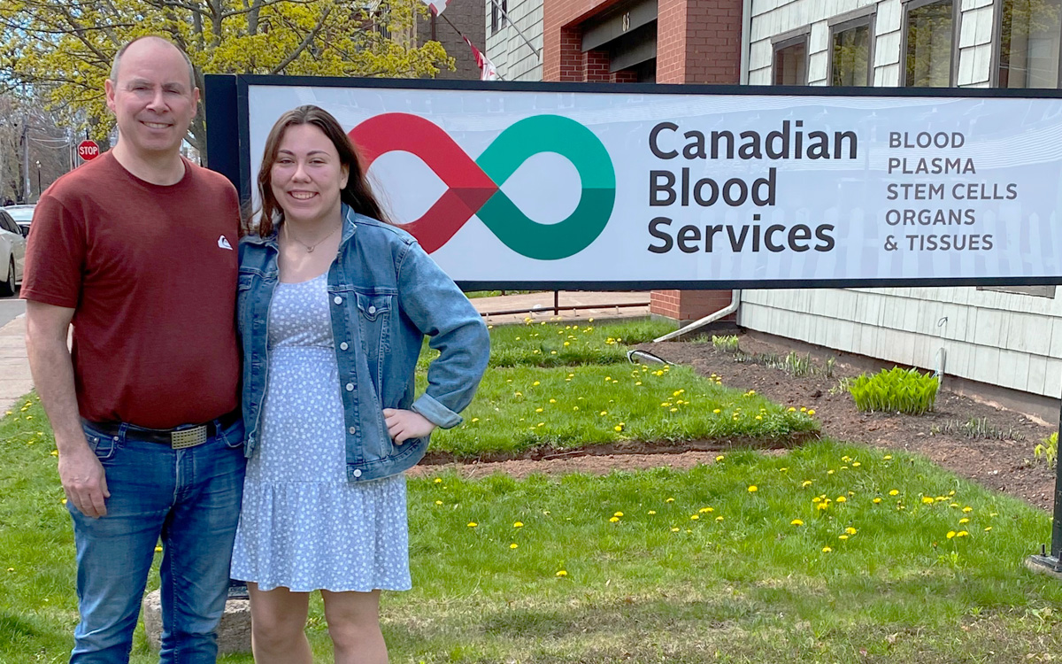 Greg and Hilary Dobbin stand in front of the donor clinic in Charlottetown, Prince Edward Island