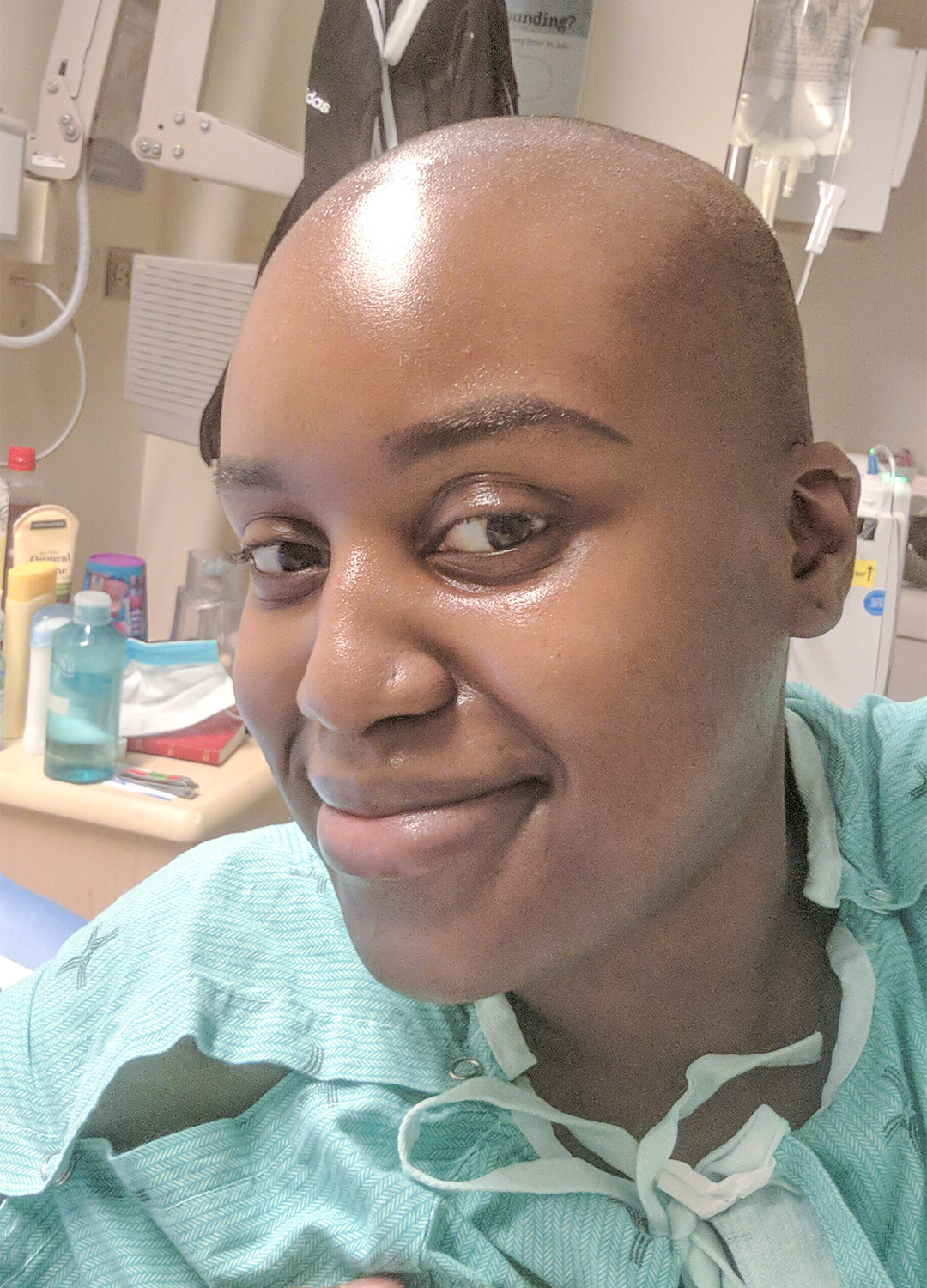 Image of Jamaique Rose in the hopsital bed for treatment at Princess Margaret Cancer Centre.