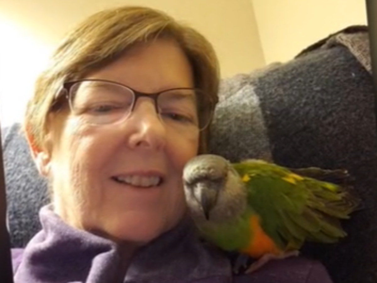 Financial donor Janet LaForest with bird on shoulder