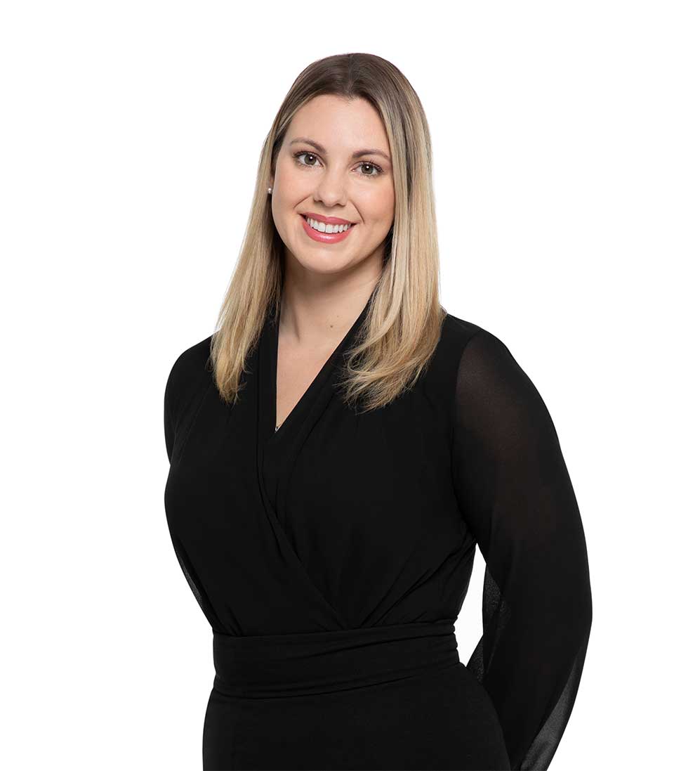 Jillian Lynch smiling on white background