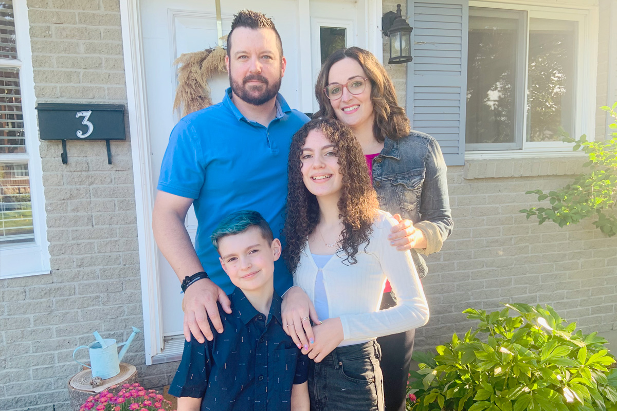 Stem cell donor Joel Menard with his wife and two children.