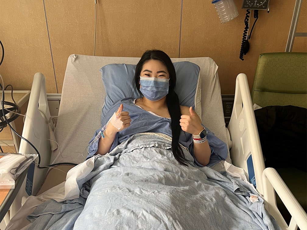 Julia gives two thumbs up after kidney donation