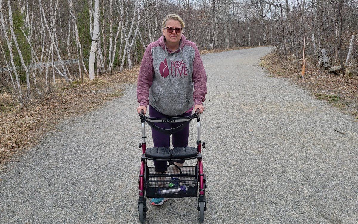 Plasma recipient with common variable immune deficiency on a trail with a walker.