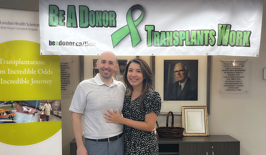 Nick and Angelica pose for a photo at a transplant centre