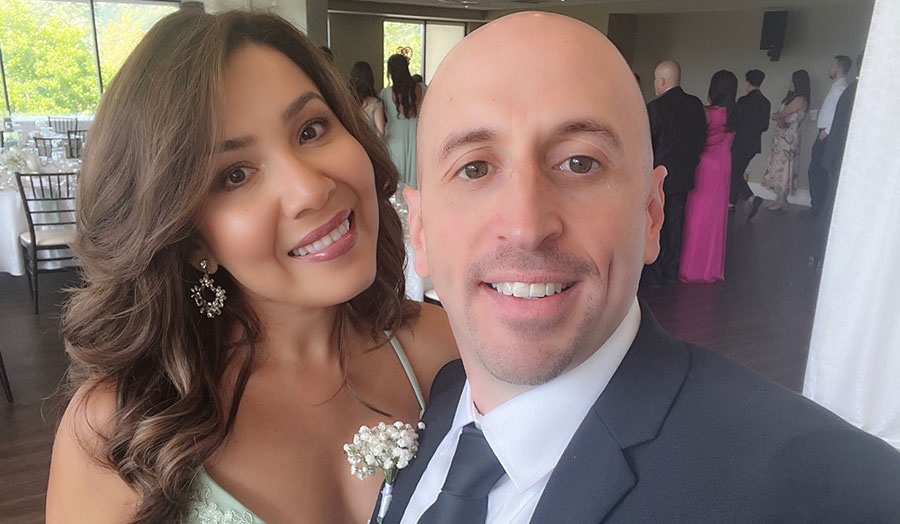 Angelica and Nick pose for a photo at their wedding