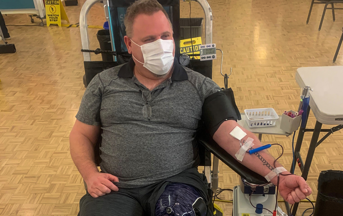 A man with a prosthetic leg donates blood in Nanaimo, British Columbia.
