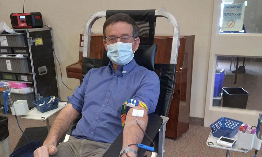 blood donor in chair donating blood