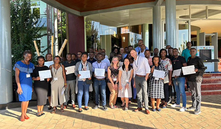 First workshop group with faculty and participants with certificates