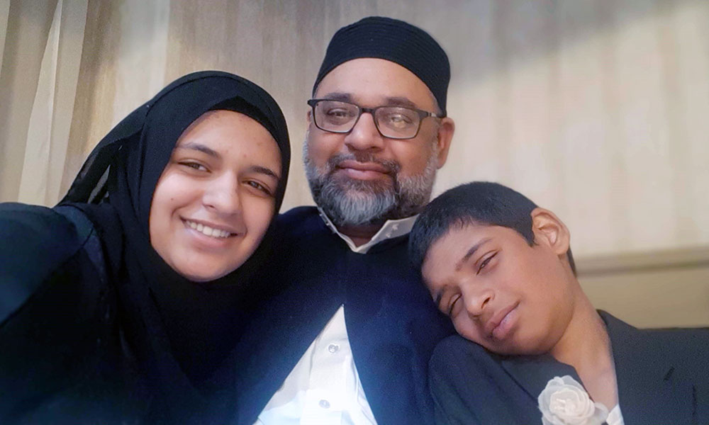 Man with daughter and son at his side