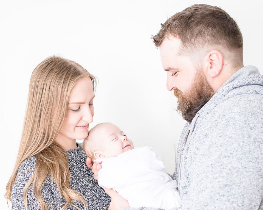 Couple holding infant son