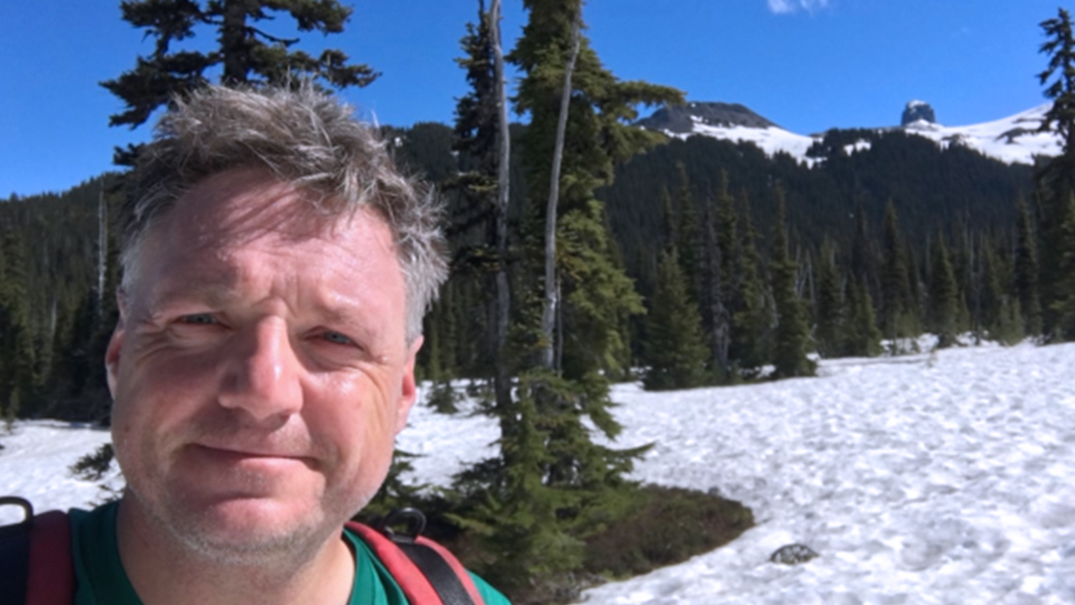 Dr. Schubert hiking on the snowy slopes in Garibaldi Provincial Park