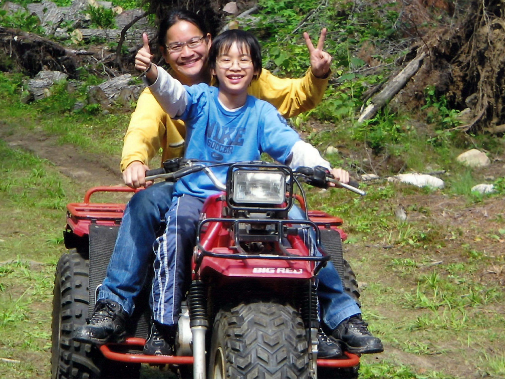 Stem cell recipient and son ride ATV together
