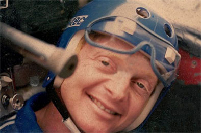 Older photo of Tom in a helmet