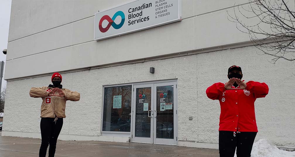 Blood donors in front of Canadian Blood Services donor centre