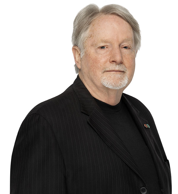 Donald Branch wearing a black blazer and a black shirt