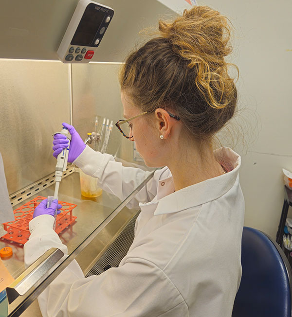 Katerina Rosenflanz wearing lab coat holding a test tube