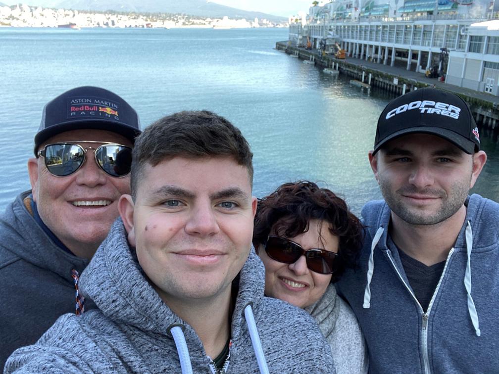 Blood recipient, Ben Becker, with his family in front of Vancouver Harbour