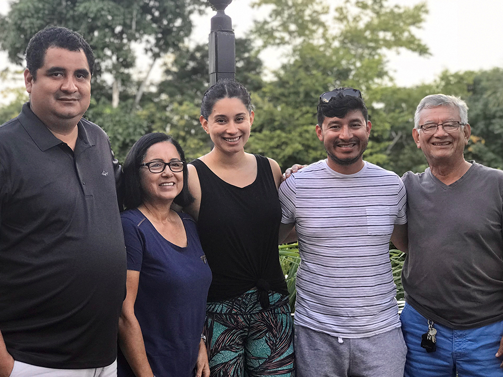 A family smiling close together