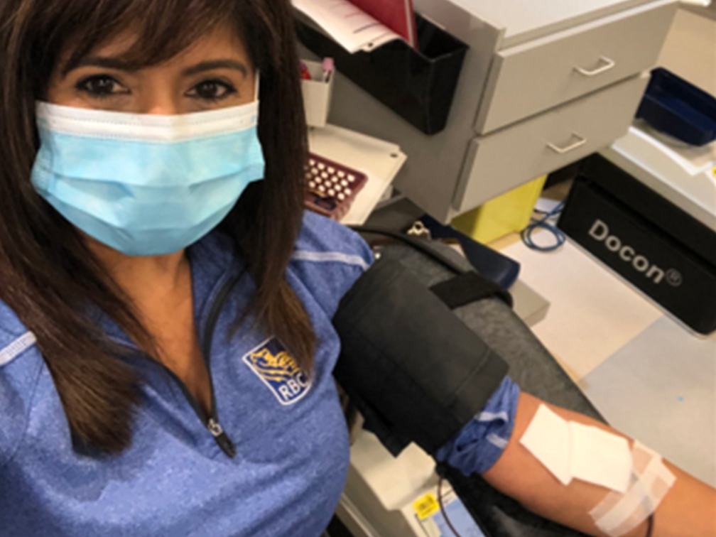 RBC employee and Partners for Life Champion Kulvit Chapman donates blood.