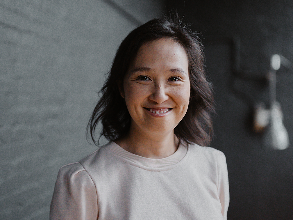 Stem cell recipient and advocate Mai Duong smile in a portrait