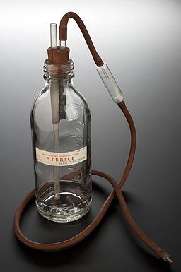 Blood transfusion bottle, capped, with associated parts, Eng Wellcome L0066184