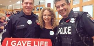 Franca Mossuto (middle), at November to Remember kick-off, in memory of late husband, Officer Frank Mossuto. Pictured with two Hamilton Police Officers.