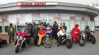 Central Chapter Nova Scotia on their motorcycles standing outside a Canadian Blood Services donor centre