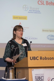 Dr. Dana Devine giving introductory remarks at the 2018 Norman Bethune Dr. Dana Devine giving introductory remarks at the 2018 Norman Bethune
