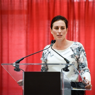 A woman speaking at a podium