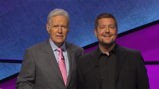 Kris Prue, right, was recently honoured by Canadian Blood Services for his 100th donation of platelets. He shared his story with Jeopardy! host Alex Trebek when he appeared as a contestant on the popular game show.