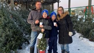 Lisa Hardill, seen here at right with her husband and two sons, says she remains healthy and strong in spite of her immune deficiency because of treatment with immune globulin 
