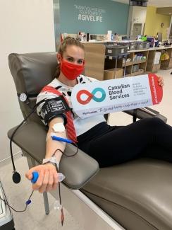 Meaghan Mikkelson-Reid donates blood at the Eau Claire donor centre in Calgary. 
