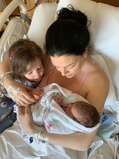 Meghan Trann received blood immediately after the birth of her daughter Ava, seen here with older sister Charlie.
