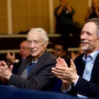 Dr. Earl W. Davie (left) enjoying presentations at the 13th annual Earl W. Davie Symposium in Vancouver.