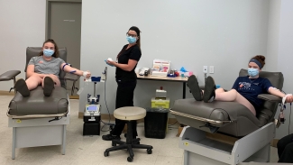 Samantha Cook, left, and her sister Jeanne Cook, right, became first-time blood donors in June