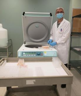 Yuntong Kou, senior assistant at our Centre for Innovation loads the centrifuge for blood sample preparation prior to the COVID-19 antibody assessment in blood donors as part of our seroprevalence study.  