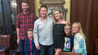 Stories-family-sized Scott Monds stands with his brother Joey Monds, his stem cell donor Danielle Bean, and Danielle’s children Finley, Jeremy and Berkley Bean.