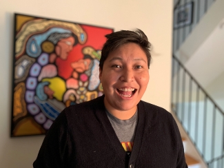 Melissa Deleary smiles in front of a painting in her home. She was honoured as an adult stem cell donor at Canadian Blood Services’ Honouring Canada’s Lifeline virtual event.