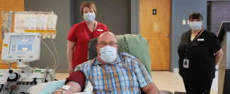 Percy Wilbur of Saint John, N.B., is the first to donate convalescent plasma in Atlantic Canada, with nurses Karla Campbell (right) and Jo-Elle Nordstrom (left) tending to him